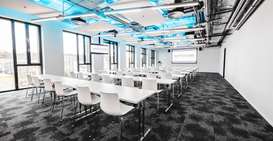 Bright and clean industrial conference room in Karlín