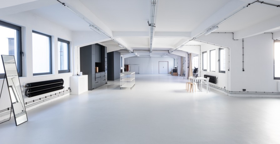 Bright industrial event space with a terrace in Karlín