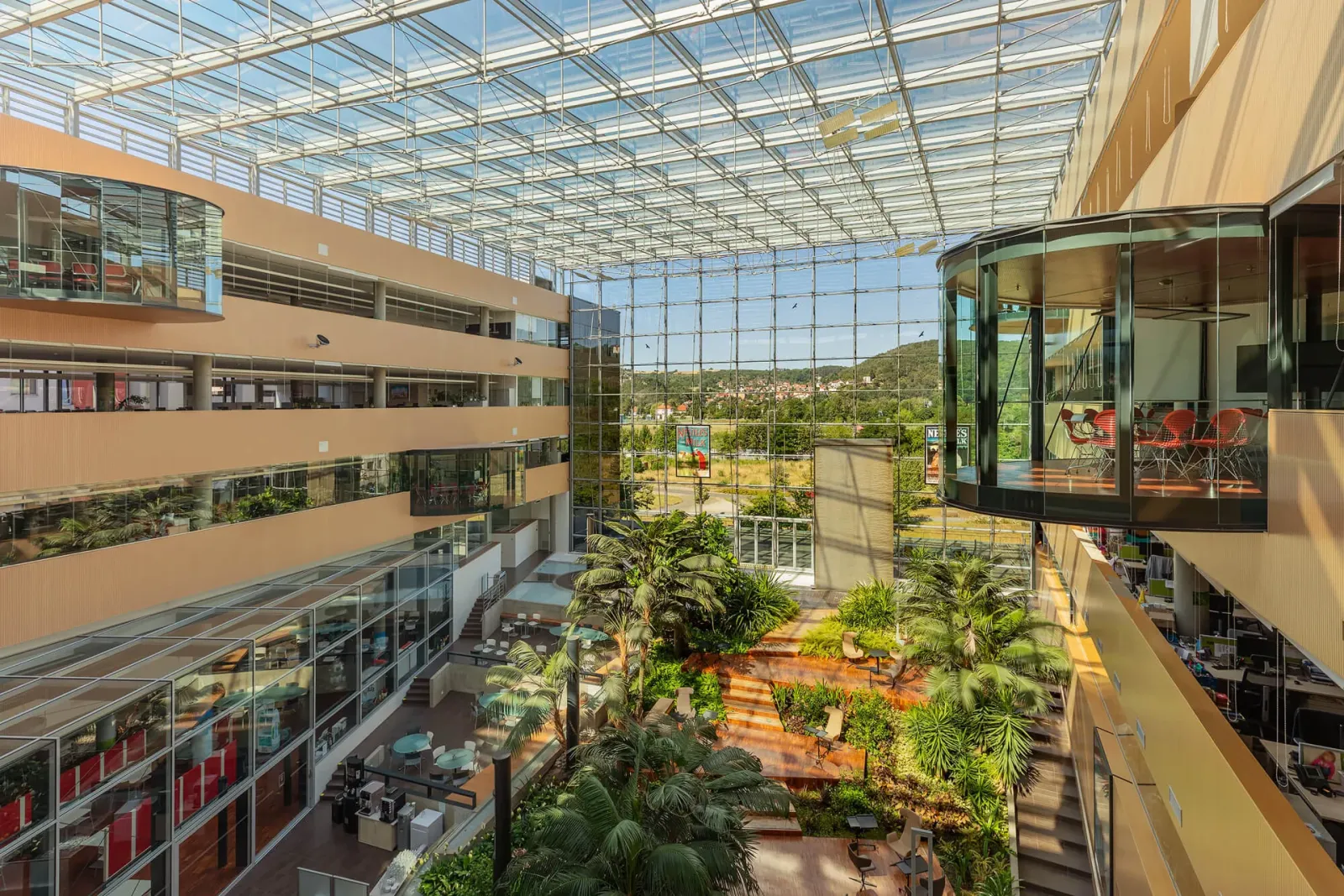 Glazed atrium with a view of the greenery